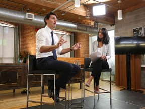 Prime Minister Justin Trudeau, left, speaks at a global town hall hosted by The Huffington Post Canada in Toronto on Monday, March 7, 2016. (THE CANADIAN PRESS/Tim Fraser - POOL)