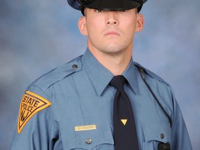 In this undated photo provided by the New Jersey State Police, N.J. State Trooper Sean Cullen is shown. Cullen died early Tuesday, March 8, 2016 from severe head injuries after being struck by a passing car while responding to an automobile accident on a New Jersey highway shortly after 8 p.m. on March 7. He was 31 years old. (New Jersey State Police via AP)