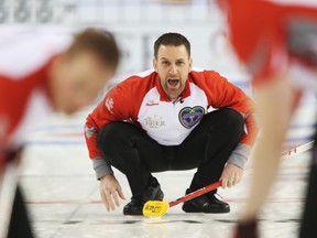 Skip Brad Gushue of Team Newfoundland and Labrador throws against Team Alberta during the Tim Horton's Brier held at TD Place in Ottawa on March 8, 2016. (Jean Levac/Postmedia)