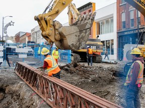 Crews at the downtown Big Dig dug up something more than dirt and concrete in Kingston on Tuesday when they came across a set of old wooden railway ties buried under Princess Street, at Montreal Street, in front of The Rocking Horse. (Julia McKay/The Whig-Standard)