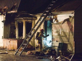 A fire tore through a home at 87 Oxford St. W. in London on Tuesday, sending one person to hospital for assessment. Derek Ruttan/The London Free Press/Postmedia Network