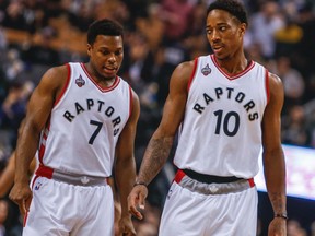 Raptors' Kyle Lowry (left) chats with DeMar DeRozan (right) during NBA action against the Nets at the ACC in Toronto on Tuesday, March 8, 2016. (Dave Thomas/Toronto Sun)