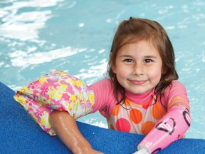 Six-year-old Lydia Pileski, from Tillsonburg, wears her swim arm which was funded thanks to public support of the War Amps Key Tag Service. (CONTRIBUTED PHOTO)
