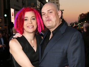 In this Oct. 24, 2012, file photo, co-directors Lana Wachowski and Andy Wachowski pose for a photo at the Los Angeles premiere of "Cloud Atlas" in Los Angeles. Four years after “Matrix” filmmaker Lana Wachowski revealed that she was transgender, her sibling and filmmaking partner formerly known as Andy Wachowski has come out as transgender too. Her name, according to a statement issued to the Windy City Times on Tuesday, March 8, 2016, is Lilly. (Photo by Todd Williamson/Invision, File)