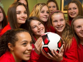 Girls from the Ottawa South United Soccer Club attend a news conference yesterday to announce that the Canadian women’s team will face Brazil on June 7 at TD Place. (Wayne Cuddington, Postmedia Network)