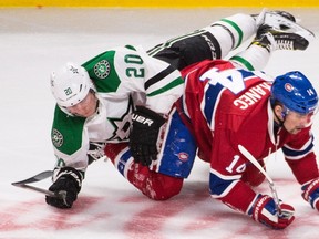 Canadiens forward Tomas Plekanec (right) collides with Stars' Cody Eakin (left) during third period NHL action in Montreal on Tuesday, March 8, 2016. (Graham Hughes/THE CANADIAN PRESS)