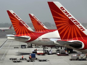 In this April 29, 2011 file photo, passenger jets from Air India, India's national carrier, stand at Indira Gandhi International Airport in New Delhi, India.  India's national carrier Air India has marked International Women's Day with an all-female crew operating the world's longest regularly scheduled direct flight, from New Delhi to San Francisco. (AP Photo/Kevin Frayer, File)