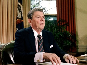 This Jan. 28, 1986 file picture shows U.S. President Ronald Reagan in the Oval Office of the White House after a televised address to the nation about the space shuttle Challenger explosion. (AP Photo/Dennis Cook)