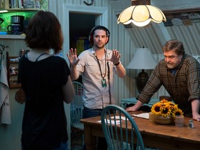 This image released by Paramount Pictures shows director Dan Trachtenberg, center, talking with actors John Goodman, right, and Mary Elizabeth Winstead on the set of "10 Cloverfield Lane." (Michele K. Short/Paramount Pictures)