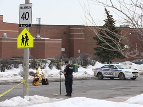 Ottawa Police investigate the city's 5th homicide of 2016 at the corner of Jasmine Crescent and Ogilvie Road in Ottawa Wednesday March 9, 2016. Nooredin Hassan, a 20-year-old man has been identified as the man shot dead Tuesday.  Tony Caldwell