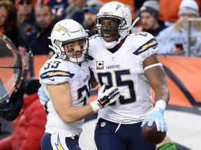 San Diego Chargers tight end Antonio Gates (85) celebrates his touchdown reception with running back Danny Woodhead (39) in the third quarter against the Denver Broncos at Sports Authority Field at Mile High. Ron Chenoy-USA TODAY Sports