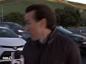 KTVU reporter Alex Savidge reacts as a car veers towards him on live TV. (KTVU/YouTube)