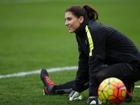 In this Jan. 23, 2016, file photo, United States goalkeeper Hope Solo warms up before a women's international friendly soccer game against Ireland in San Diego. Solo went to Twitter to show her concern about the field conditions at FAU Stadium for Wednesday night's match against Germany. The national team has complained about fields before: Last year a match in Hawaii was called off because of worn artificial turf. (AP Photo/Gregory Bull, File)