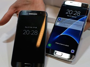 In this Sunday, Feb. 21, 2016, file photo, a Samsung Galaxy S7, left, and S7 edge are displayed during the Samsung Galaxy Unpacked 2016 event on the eve of the Mobile World Congress wireless show, in Barcelona, Spain. (AP Photo/Manu Fernadez, File)