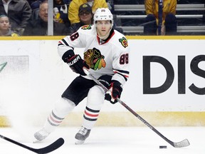 In this Jan. 19, 2016, file photo, Chicago Blackhawks right wing Patrick Kane controls the puck against the Nashville Predators in the third period of an NHL hockey game in Nashville, Tenn. (AP Photo/Mark Humphrey, File)