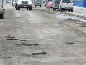 St. Matthews Avenue near Hampton Street in Winnipeg, Man. is seen covered in potholes earlier this year. As bad as this is, the street didn't even make the top 10 of CAA Manitoba's Worst Roads competition. (FILE PHOTO)