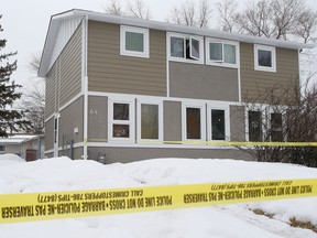 Police tape surrounds a duplex at 64 Allenby Crescent in Winnipeg, Man. Wednesday March 9, 2016 after a 45-year-old male was fatally stabbed late Tuesday evening.