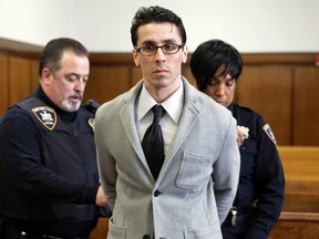 A court officer removes handcuffs from Elliot Morales at Supreme court, in New York.   (AP Photo/Richard Drew, File)