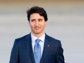 Canadian Prime Minister Justin Trudeau walks to a motorcade vehicle after arriving at Andrews Air Force Base, Md., Wednesday, March 9, 2016. (AP Photo/Cliff Owen)