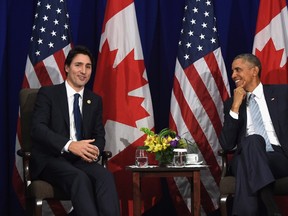 In this Nov. 19, 2015 file photo, President Barack Obama listens as Canada's Prime Minister Justin Trudeau speaks during a bilateral meeting in Manila, Philippines. Trudeau Wednesday begins his first prime ministerial visit to the U.S.  which will also feature the first White House state dinner for a Canadian in 19 years. THE CANADIAN PRESS/AP,Susan Walsh