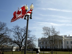 A Canadian flag flutters on a lamp post along Pennsylvania Avenue outside the White House in Washington March 7, 2016.  Preparations are under way for the official state visit of Canada's Prime Minister Justin Trudeau on Thursday. REUTERS/Kevin Lamarque