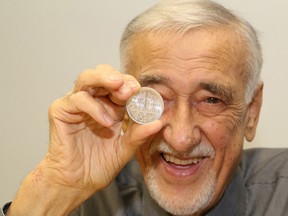 In this file photo, Ted Szilva, creator of the Big Nickel, holds a medallion. John Lappa/The Sudbury Star