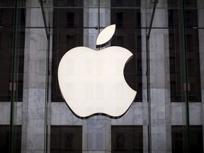An Apple logo hangs above the entrance to the Apple store on 5th Avenue in New York City, in this file photo taken July 21, 2015.   REUTERS/Mike Segar/Files