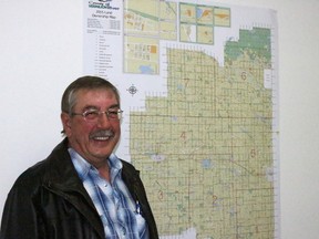 Lonnie Wolgien, the newest County of Vermilion River councillor, stands in front of a county map at his JSK Sales & Service office in Vermilion.
