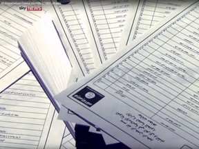 Documents identifying supporters of Islamic State are seen in this still image from video, released by Sky News to Reuters in London on March 10, 2016. (REUTERS/Sky News/Handout via Reuters)