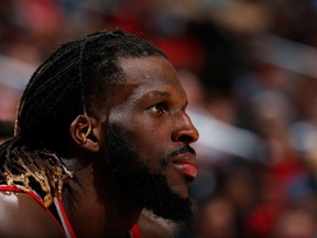 DeMarre Carroll of the Toronto Raptors looks on from the bench against the Atlanta Hawks at Philips Arena in Atlanta on Dec. 2, 2015. (Kevin C. Cox/Getty Images/AFP)