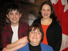 Omar Elchami (left), mom Katrina Elchami (centre), from  Windsor, and friend Becca Haggitt from Centralia, Ont. pose at Queen's Park on Thursday March 10, 2016. to plead with government to keep that school, plus other demonstration schools and schools for the deaf, open. Christina Blizzard/Toronto Sun/Postmedia Network