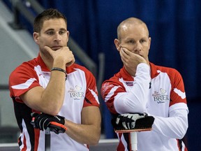 Team Canada skip Pat Simmons (right) and third John Morris (left) lost to Team Alberta at the 2016 Brier in Ottawa and were eliminated from the playoffs on Thursday, March 10, 2016. (Errol McGihon/Postmedia Network)