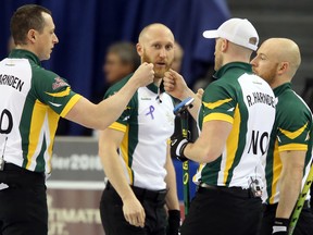 Team Northern Ontario celebrate their win against Team Manitoba during the Tim Hortons Brier held at TD Place in Ottawa on Thursday, March 10, 2016. (Jean Levac/Postmedia Network)