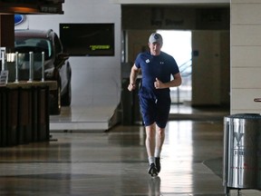 Toronto Maple Leafs coach Mike Babcock runs around the concourse of the Air Canada Centre in Toronto as his team finishes up the game-day skate on March 9, 2016. (Michael Peake/Toronto Sun/Postmedia Network)