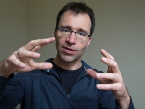 Western University researcher Jorn Diedrichsen uses robotics to figure out how certain hand movements may stimulate the brain and help regain hand function in patients recovering from stroke and spinal cord injuries. (DEREK RUTTAN, The London Free Press)