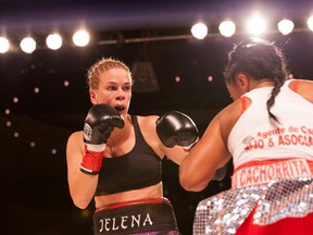 Jelena Mrdjenovich, shown here in a bout in September 2014, will be fighting for the WBC and WBA featherweight titles when she gets in the ring with Edith Matthysse on Friday. (File)