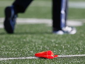 A penalty flag lies on the turf as the Stampeders face the Blue Bombers during CFL action in Calgary on July 18, 2015. (Al Charest/Postmedia Network/Files)