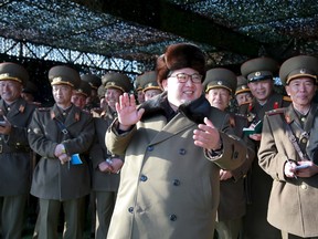 North Korean leader Kim Jong Un smiles while watching the Korean People's Army (KPA) tank crews' competition at an unknown location, in this undated photo released by North Korea's Korean Central News Agency (KCNA) in Pyongyang, on March 11, 2016. (REUTERS/KCNA)