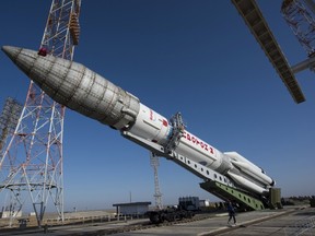 The Proton rocket, that will launch the ExoMars 2016 spacecraft to Mars, is lifted on the launchpad at the Baikonur cosmodrome, Kazakhstan, in this handout photo released by European Space Agency (ESA) on March 11, 2016. (REUTERS/Stephane Corvaja/ESA/Handout via Reuters)