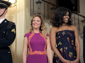U.S. first lady Michelle Obama and Sophie Gregoire-Trudeau stand together before a State Dinner at the White House in Washington March 10, 2016.      REUTERS/Joshua Roberts