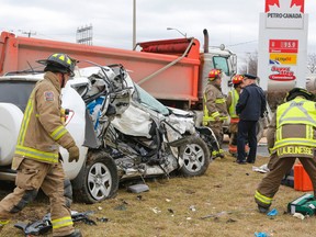 Two women are lucky to be alive after their SUV was T-boned by a dump truck in the intersection of Albion Rd. and Hwy. 27. in Etobicoke. The truck was eastbound on Albion Rd. when the westbound SUV made a left turn into the path of the truck on March 11, 2016. (Dave Thomas/Toronto Sun)