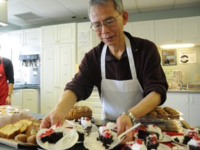 Jason Miller/The Intelligencer
Salvation Army volunteer Steven Chan assists with the preparation of dessert to be served in the Warm Room meal program.