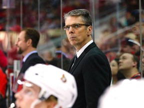 Ottawa Senators head coach Dave Cameron looks on from the bench against the Carolina Hurricanes at PNC Arena. The Carolina Hurricanes defeated the Ottawa Senators 4-3. James Guillory-USA TODAY Sports