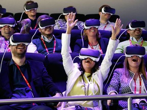 People test Samsung Gear VR glasses at their stand during the Mobile World Congress in Barcelona, Spain Feb. 23, 2016. REUTERS/Albert Gea