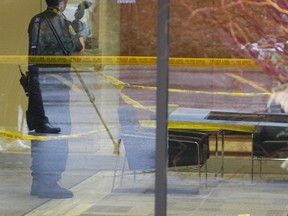 Toronto Police Forensics officers gathered evidence in the lobby of a Rosedale apartment building after a man, 67, was stabbed Thursday morning. CHRIS DOUCETTE/TORONTO SUN