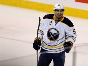 Buffalo Sabres' Evander Kane smiles after assisting on a goal by Sam Reinhart during third period NHL hockey action against the Winnipeg Jets' in Winnipeg, Sunday, January 10, 2016. (THE CANADIAN PRESS/Trevor Hagan)