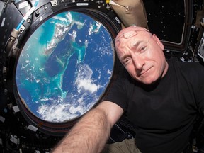 NASA astronaut Scott Kelly is seen inside the cupola of the International Space Station, a special module that provides a 360-degree viewing of the Earth and the station in this undated photo released on March 11, 2016. The astronaut who currently holds the American record for most time spent in space, Scott Kelly, will retire from NASA as of April 1, NASA said on Friday.  REUTERS/NASA/Handout via Reuters