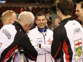 Craig Savill (middle) enjoys a laugh with Glenn Howard, left, Joey Hart  and Richard Hart of Team Ontario during the Tim Hortons Brier on Thursday, March 10, 2016.