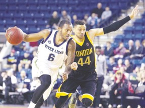 B.J. Monteiro of the Niagara River Lions drives by London Lightning guard Ryan Anderson during their National Basketball League of Canada game in St. Catharines on Friday. The Lightning lost 100-98. (Julie Jocsak, St. Catharines Standard)