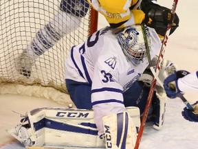 Kingston Frontenacs right-winger Spencer Watson catapults over Mississauga Steelheads goaltender Jack Flinn during the second period of Ontario Hockey League action at the Rogers K-Rock Centre in Kingston on Friday. Watson drew a penalty on the play. (Elliot Ferguson/The Whig-Standard)